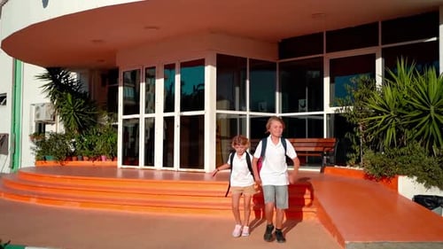 Students Running to Parents After Elementary Primary Middle School Classes or Break Back to School