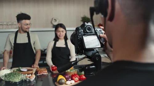 Adults Presenting Vegetables in Modern Kitchen Setting