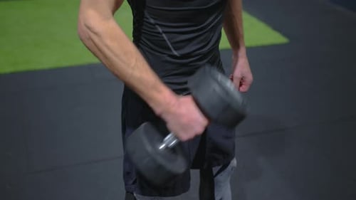 A Male Athlete Performs Complex Exercises to Maintain His Health and Body in Great Shape
