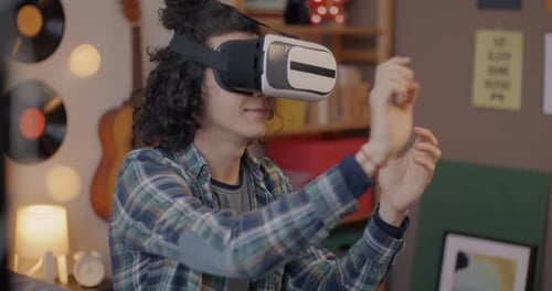 Young Adult Using Virtual Reality Headset Indoors