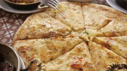 Turkish and Arabic Traditional Baked Pita with Butter Cheese and Spicy Herbs