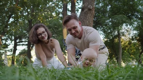 Happy Family Enjoying Day in Sunny Urban Park
