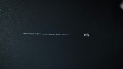 Writing exclamation mark with chalk on blackboard. Vertical video