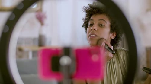 African American Vlogger Streaming Makeup Tutorial for Her Vlog
