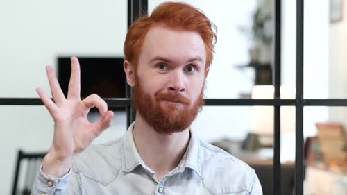 Red Haired Man Makes OK Hand Gesture
