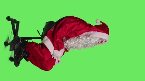 Vertical Video Side View of Santa Claus Embodiment Poses on Chair