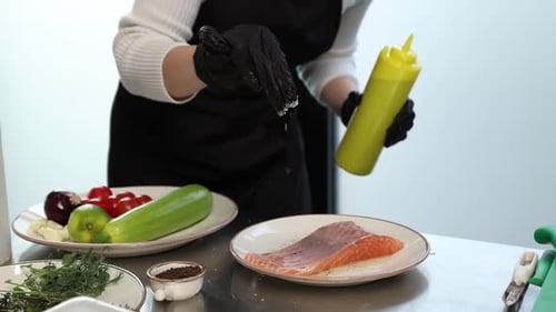 chef prepares a salmon dish in the kitchen. Close-up shots