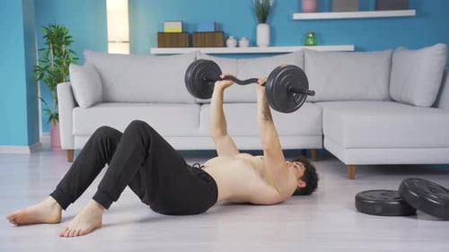 Man Doing Bench Press Exercise at Home