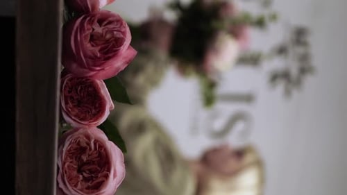Florist girl works in flower shop Elya