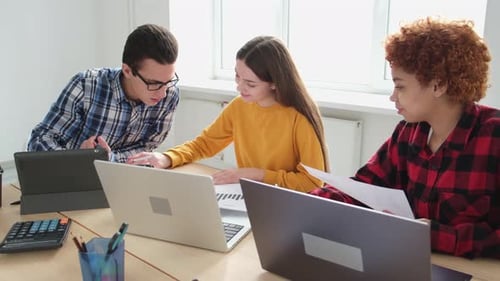 Young Professionals Collaborate at Bright Modern Office