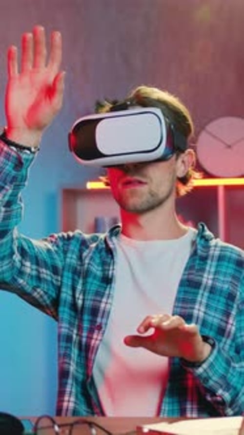 Man Wearing VR Headset Using Hand Gestures