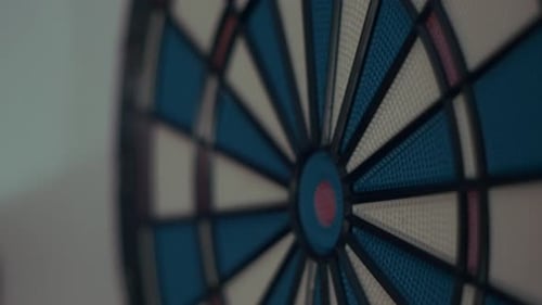 Close-up Dart Hit em Bullseye. Precision Dartboard
Target Success