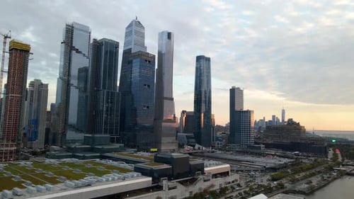 Aerial view of the Hudson Yards skyline, dusk in New York - pull back, drone shot