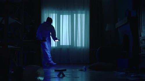 Investigators Examine Dark Indoor Crime Scene at Night