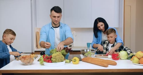 Family Prepares Healthy Meal in Bright Kitchen