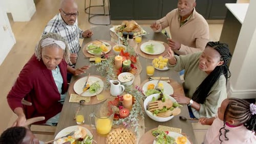 Family Celebrates Holiday Meal Together at Home