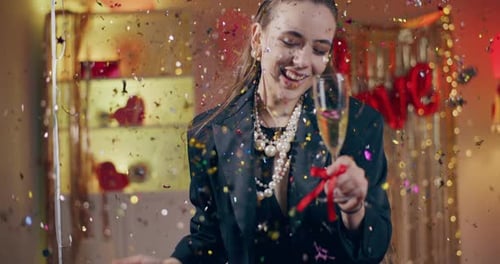 Young Woman Celebrates Birthday with Champagne and Confetti