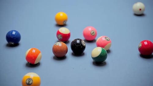 Billiard opening break shot. In a billiard club or a night club billiard balls are on a pool table,