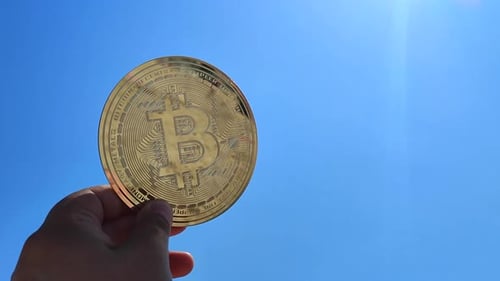 Bitcoin Coin Close Up Person Holding Bitcoin Coin Hand on Background Blue Sky