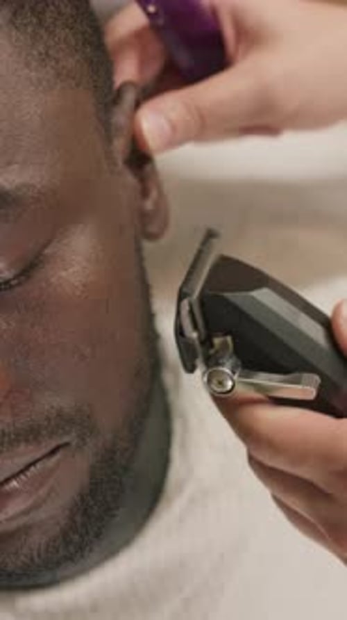 Adult Getting a Haircut with Trimmer