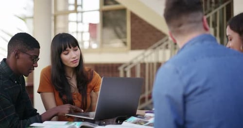Young Adults Studying Together Outdoors at College