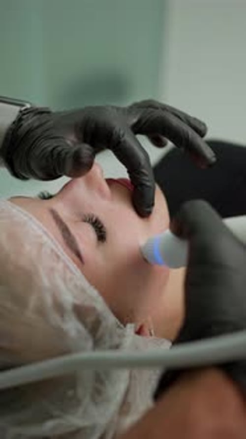 Woman Receives Facial Treatment in Vertical Format