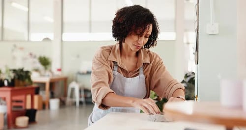 Creative, pottery and shape with woman in boutique for crafting, manufacturing