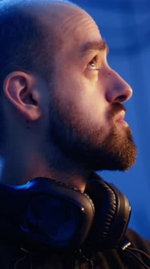 Vertical Video Hacker Looking Over Shoulder and Feeling Anxious After Stealing Data