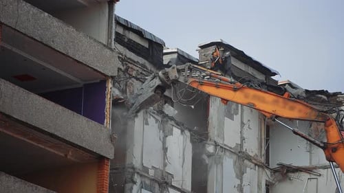 Demolition building after nature disease. Urban excavator destruction demolishing.