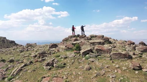 Aerial View Of Hikers Enjoying The View On The Hill
