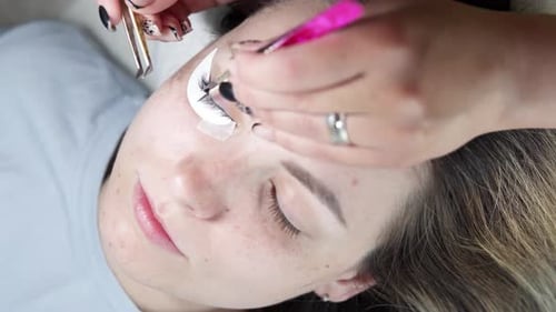 Eyelash Extensions Applied With Tweezers, Close Up