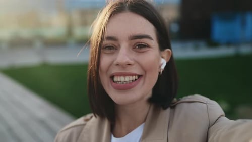 POV Webcam View of Charming Girl Waving Talking on Video Call Using Smartphone While Standing in