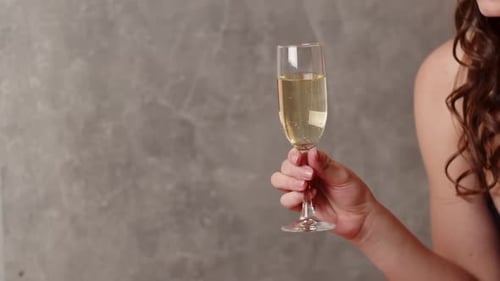 Woman Holding Glass of Sparkling Champagne
