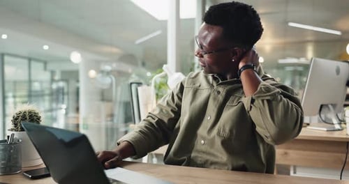 Black man, night and laptop with neck pain for stress, injury or overworked at office desk