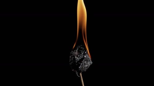 Burning Object with Bright Flames on Black Background