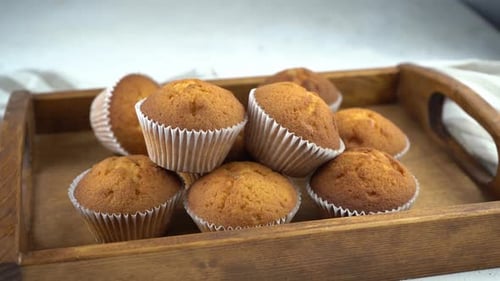Golden Muffins on a Rustic Tray, Close Up