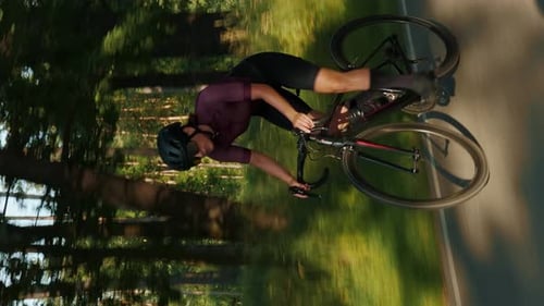 Cycling. Woman training on bicycle