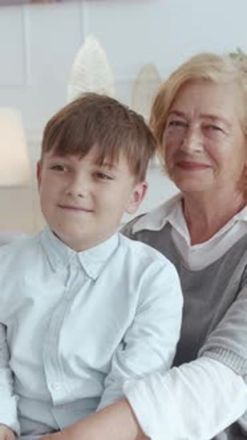 Grandmother and Grandson Smiling Together Indoors