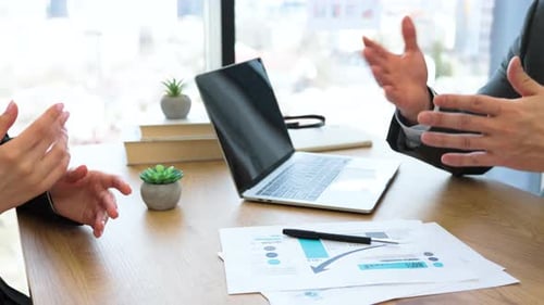Business Professionals Shaking Hands After Successful Meeting Conclusion