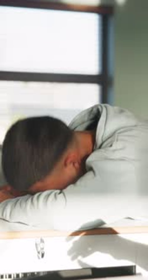 Student, sleeping and education in classroom, fatigue and teenager with low energy on desk or tired
