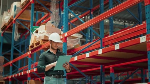 Portrait of young Caucasian male worker wearing helmet