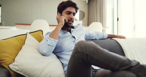 Man Relaxing at Home Talking on Phone