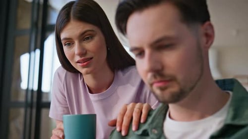 Couple Conversing Indoors in Modern Home