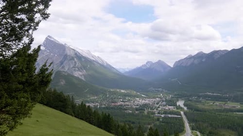 Panning Shot from Hill of Banff, Alberta with Snowy Mountain Range in background