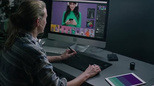 Woman Editing Photos at her Computer Workstation