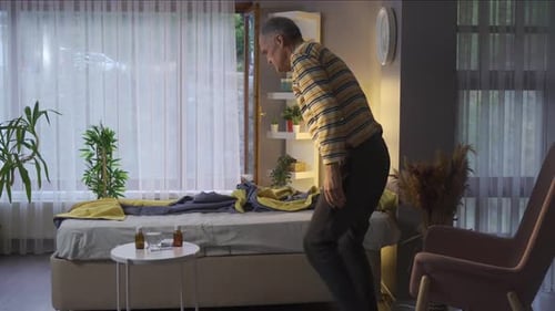 Senior Man Experiencing Discomfort Lying Down