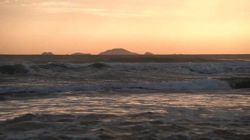 A View of a Beautiful Sunset on the Sea Waves in Slow Motion