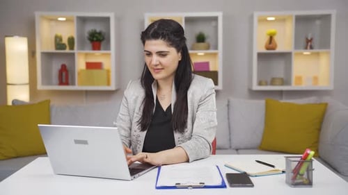 Home office worker woman happy and smiling.