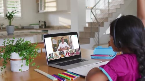 Girl Attends Online Class with Teacher and Classmates