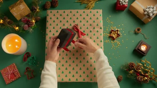 Close Up of Male Hands Packing Christmas Gifts for Girlfriend Christmas Decor